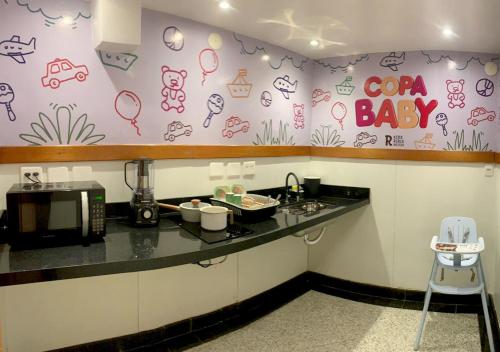 a kitchen with a counter with a coffee maker at Riale Imperial Flamengo in Rio de Janeiro