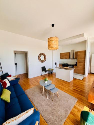 Ruang duduk di L'Herboriste - Appartements meublés