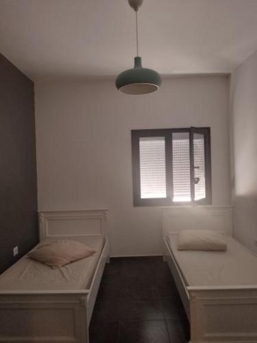 Llit o llits en una habitació de Azur’House