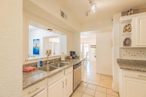 a kitchen with a sink and a counter top at Villa DeLuna in Pensacola Beach