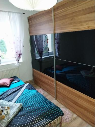 Llit o llits en una habitació de Ferienwohnung Einsiedel