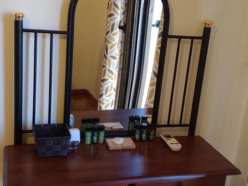 a wooden desk with a phone on top of it at Chez Flik San Rocco Sq in Agios Rokkos