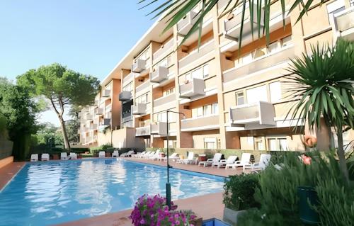 an image of a swimming pool in front of a building at Nonna Cocchina House Rome close to Vatican City in Rome