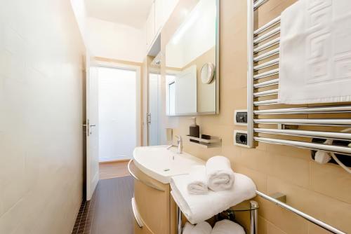 a bathroom with a sink and a mirror at Nonna Cocchina House Rome close to Vatican City in Rome
