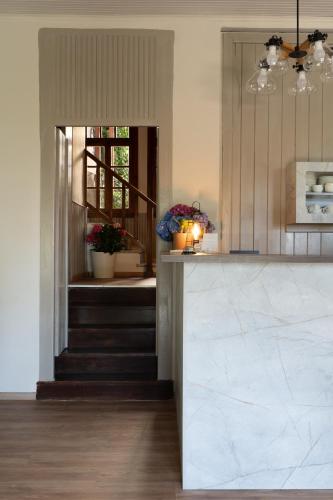 a kitchen with a marble counter top and a window at KissosInn in Kissós