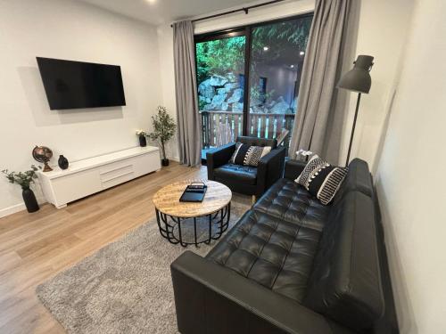 TV a/nebo společenská místnost v ubytování cottage NOMAD