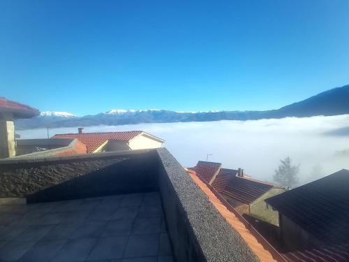a view from the roof of a house overlooking a foggy lake at Casa vacanza toscana in Fivizzano