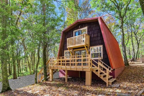 a tree house in the middle of the woods at Private Lake&Beach w Golf, Fire Pit, Deck & WiFi! in Terra Alta