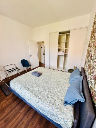 Katil atau katil-katil dalam bilik di L'Herboriste - Appartements meublés