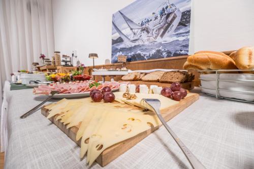 a table with bread and other food on it at Penzion Kozí Horka u Brněnské přehrady in Brno
