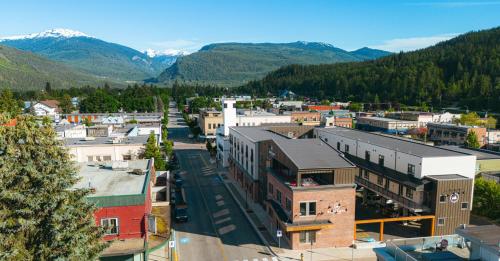 an aerial view of a small town in the mountains at Basecamp Suites Revelstoke in Revelstoke