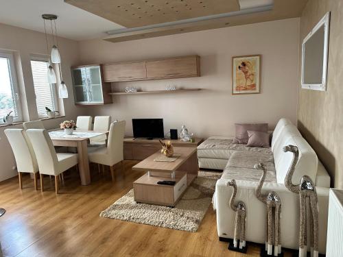 a living room with a couch and a table at Pahira Lux in Paraćin