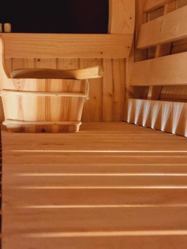 an empty room with a wooden floor and stairs at Apartament Paula in Jelenia Góra