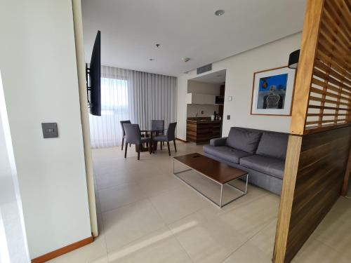 a living room with a couch and a table at Holiday Inn Express Puerto Vallarta by IHG in Puerto Vallarta