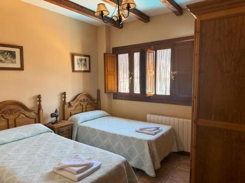 Postel nebo postele na pokoji v ubytování casa santos