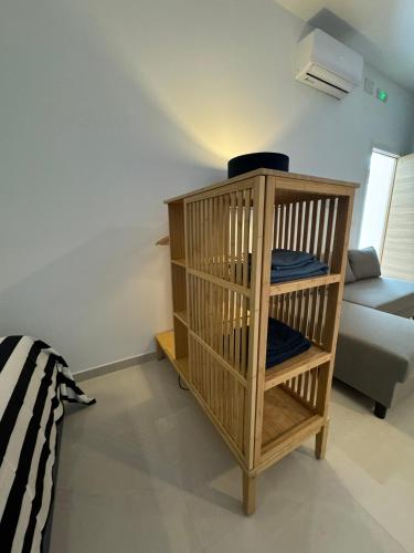 a room with a wooden cage with a couch at La Casa de Rosita in Fuente del Maestre