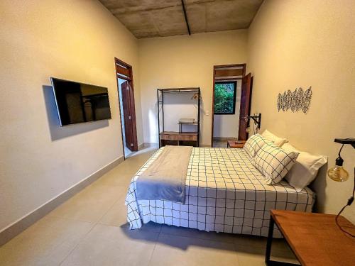 Ένα ή περισσότερα κρεβάτια σε δωμάτιο στο Refúgio cheio de estilo para dias de sossego