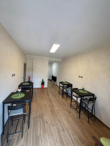 an empty room with tables and chairs in it at Regina di Puglia in Santeramo in Colle