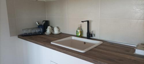 a white sink on a counter in a bathroom at 7 Olmi b&b Bologna in Carteria di Sesto Rastignano
