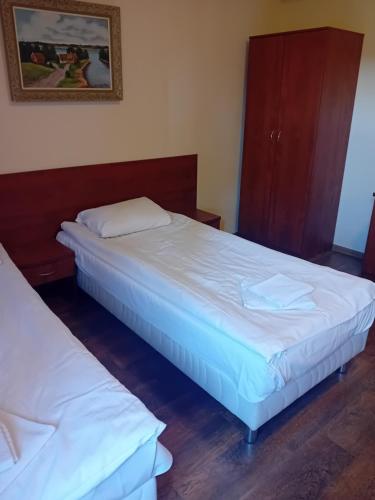 Postel nebo postele na pokoji v ubytování Osada Popowo Zajazd Jan