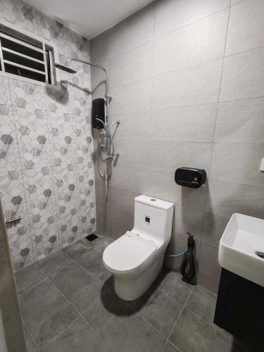 a bathroom with a toilet and a sink at Melaka privatepool bungalow BBQWIFI krubong in Malacca