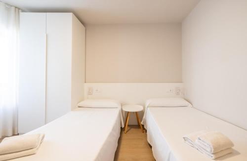 Ένα ή περισσότερα κρεβάτια σε δωμάτιο στο Apartaments Voralmar - Mas d'en Gran