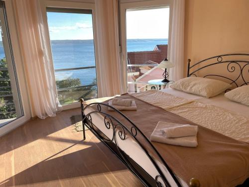 Posteľ alebo postele v izbe v ubytovaní Villa Mebelle mit Meerblick