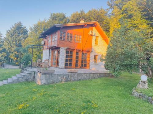 a house with an orange in a yard at Villa Ema in Sarajevo