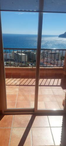 a view of the ocean from a room with a window at Casa Del Sol La Herradura in La Herradura