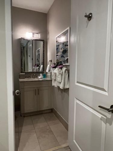 a bathroom with a sink and a mirror at Endless Summer 42 in Key Largo