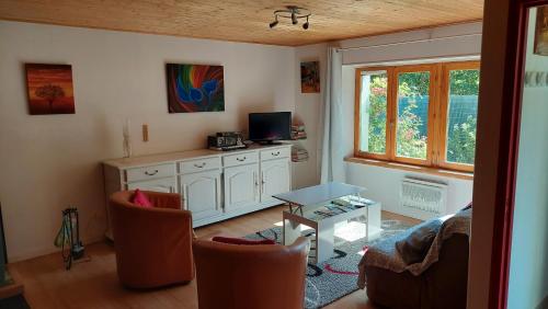 TV a/nebo společenská místnost v ubytování Gîte Ô Valet