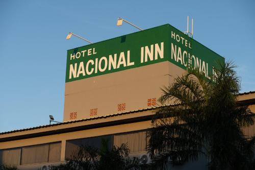 a sign on the top of a hotel national inn macana at Hotel Nacional Inn São Carlos & Convenções in São Carlos