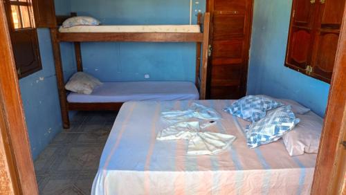 Cama ou camas em um quarto em Caminhos do Mar Hostel