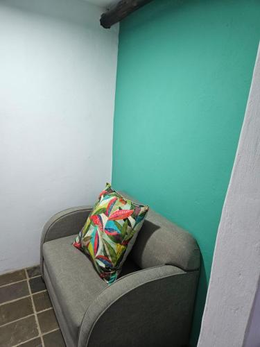 a pillow sitting on a couch in a room at Bali at Scenic Haven Lodge in Hartbeespoort in Hartbeespoort