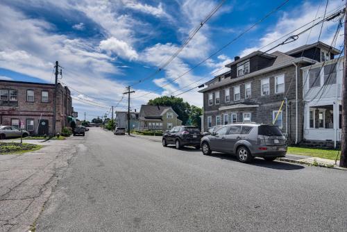 an empty street in a small town with cars parked at Pet-Friendly Stoughton Apartment with Outdoor Space in Stoughton