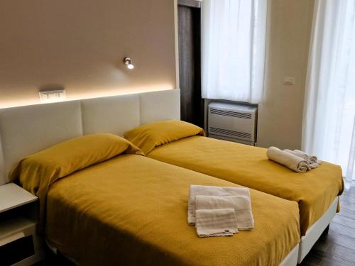Ένα ή περισσότερα κρεβάτια σε δωμάτιο στο Belfiore Alloggi Turistici