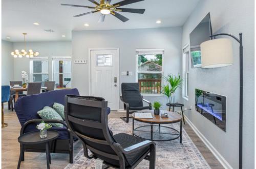 a living room with a couch and chairs and a fireplace at Heaven-sent Convenient 4BR 3BA Near Downtown in San Antonio