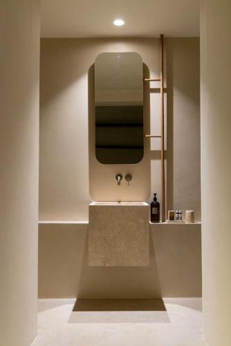 a bathroom with a sink and a mirror at casa eterna in Agios Romanos
