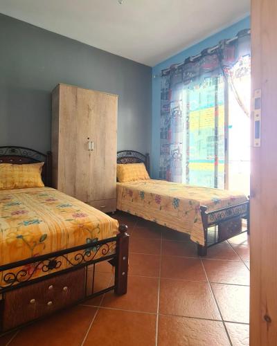 Postel nebo postele na pokoji v ubytování Ouedlaou, Residence AL FAJR