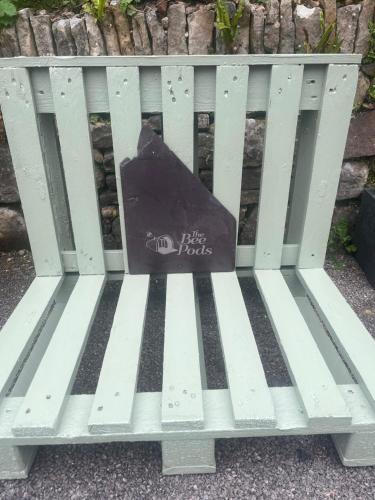 a black bag sitting on a white bench at The Bee Pods in Rossnowlagh