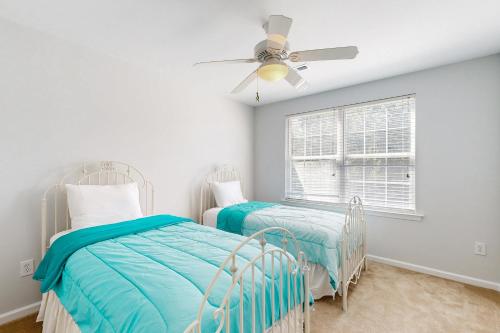 a bedroom with two beds and a ceiling fan at The Reserves of Nassau - 17295 Queen Anne Way in Lewes