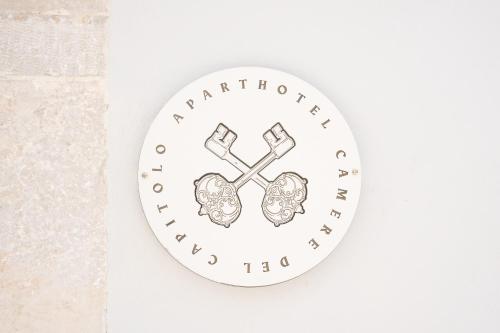 a white clock with a brain and the words microbiotherapyromyalgia at Aparthotel Camere del Capitolo in Bisceglie