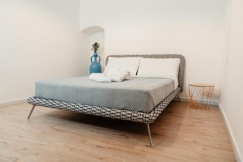 a bed in a room with a cheetah print bed frame at Aparthotel Camere del Capitolo in Bisceglie