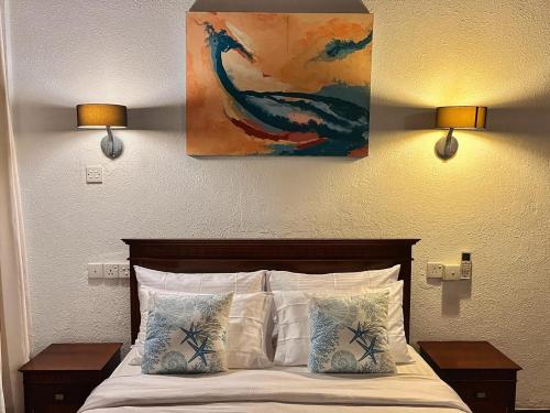 Ένα ή περισσότερα κρεβάτια σε δωμάτιο στο Nilaveli Bay Villa by Ceylon Spaces
