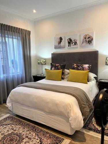 Ένα ή περισσότερα κρεβάτια σε δωμάτιο στο Tree Aloe Guest house