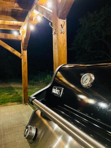 a car parked under a gazebo at night at Pension U Babi in Chrášťany