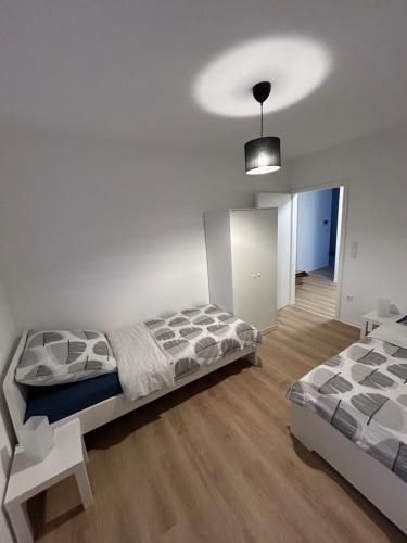 En eller flere senge i et værelse på ID Apartmenthaus