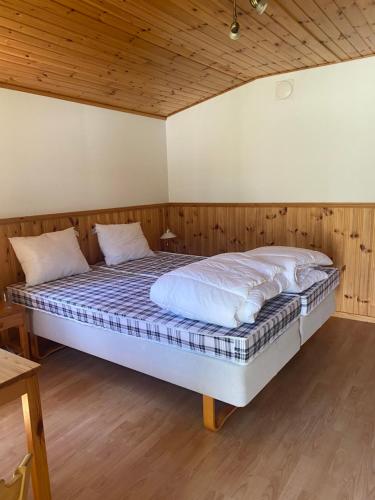 Postel nebo postele na pokoji v ubytování När golfklubb stugbyn