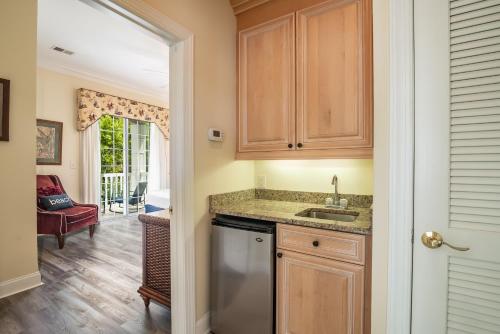 a kitchen with a sink and a dishwasher at Litchfield Beach & Golf Resort in Pawleys Island