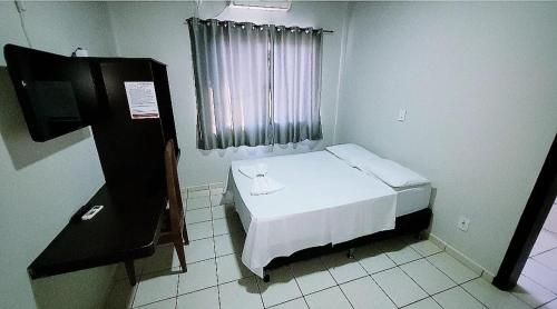 Postel nebo postele na pokoji v ubytování Hotel Valentine